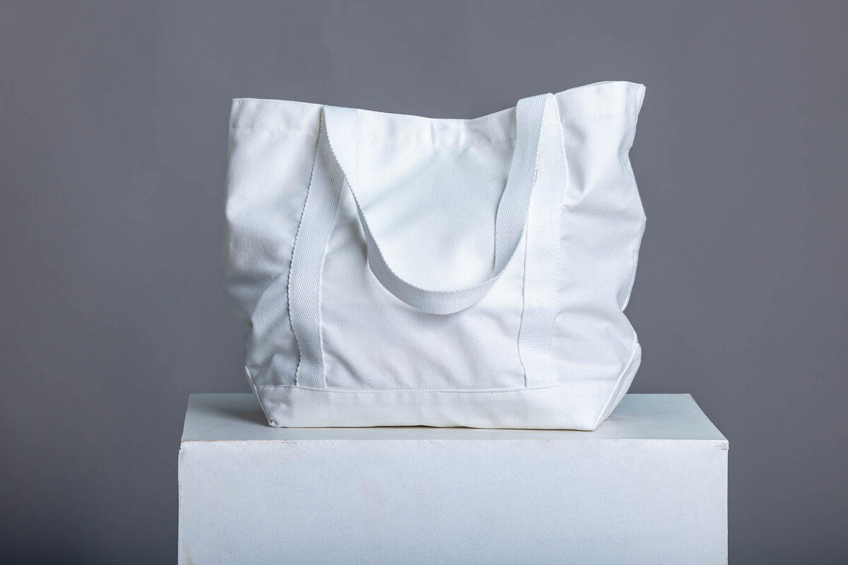 ADC White Tote — lifestyle worn
